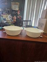 Both Pyrex bowls side by side showing exterior pattern and handles
