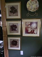 All four framed prints hanging together
