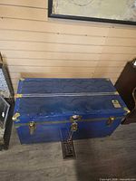 Top view of blue metal Union Trunk steamer trunk with brass hardware