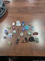 Top-down view of entire lapel pin collection on table