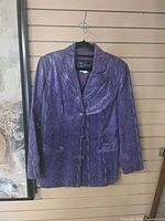 Front view of purple snakeskin leather blazer hanging