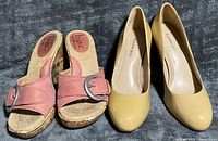 Both pairs side by side showing uppers, footbeds and branding