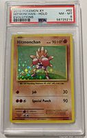 Front of PSA-slabbed Hitmonchan holographic card showing label details and card artwork