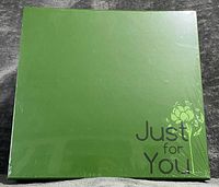 Front of sealed green gift box with "Just for You" text
