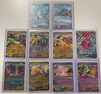 Front view of ten of the cards displaying holographic artwork and rarities