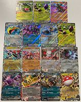 All sixteen Pokémon EX full-art cards laid out for inspection