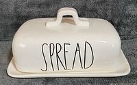 Front view of assembled butter dish showing “SPREAD” text