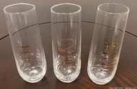 Three stemless champagne flutes showing size and personalization