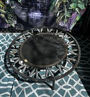 Overall view of the 36" mini trampoline rebounder showing metal frame, springs, mat, and legs