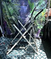 Full side view of the white and black foldable air walker elliptical glider