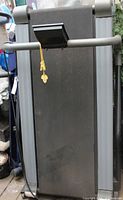 Full view of folded treadmill front