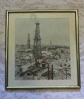 Full view of framed photograph showing oil derricks and frame