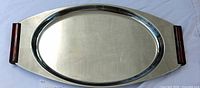 Top view of entire chrome tray showing oval well and Bakelite handles