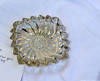 Top view of clear glass swirl ashtray showing full pattern and edge