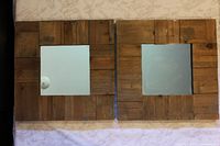 Front view showing both square wood framed mirrors
