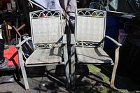Front view of both beige mesh patio chairs showing overall style and condition