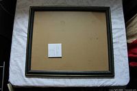 Blue and gold frame front on white surface
