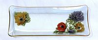 Top view of entire glass tray showing floral design and gold rim