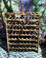Full view of wooden wine rack front showing overall structure and capacity