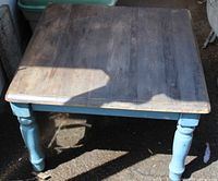 Overall top view of square wood coffee table