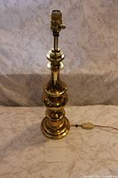 Full view of brass table lamp showing overall design and height