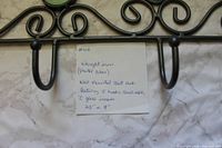 Close-up of center hooks and seller note showing material and dimensions