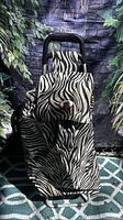 Front view of zebra print folding shopping trolley cart