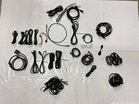 Overview of all assorted cables laid out on white background