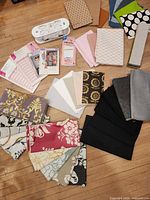 Top view of entire lot showing assorted fabric pieces, sewing patterns, interfacing roll and seam binding