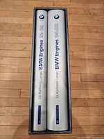 Spines of both volumes inside slipcase