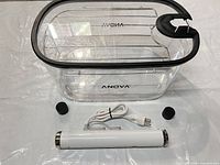 Anova container with lid and rack, Breville circulator with cord, two magnetic weights