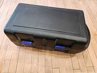 Closed black plastic carrying case
