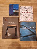 All four design books laid out face up