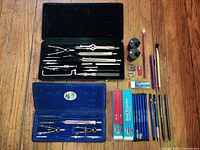 Overview of both compass sets, sharpeners, lead boxes, pencils and accessories