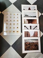 All seven framed pieces laid out on floor