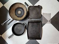 All five cookware pieces laid out front side up