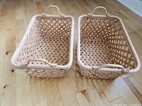 Two rectangular rattan baskets side by side