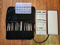 Full set: brush roll with brushes, plastic organizer, tray of 18 paint tubes, open box lid