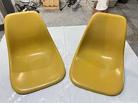 Top view of both yellow fiberglass chair shells