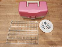 Overall lot showing Plano box, metal rack, embroidery hoop