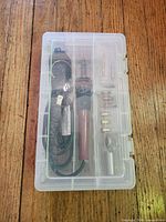 Closed clear plastic case showing contents inside