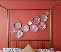 Plates displayed above headboard, showing full set and color/pattern variety