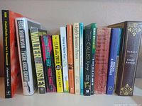 Full shelf view of all book spines
