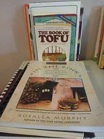 Front view of In the Pink and The Book of Tofu with other books