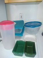 Tupperware containers, juice pitcher, loaf pans, white dish