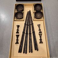 Full set in storage box showing six chopstick pairs, four bowls, four rests