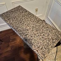 Top view showing speckled granite surface and rectangular shape