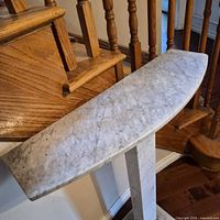 Marble console table top showing veining and curved front edge