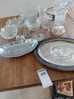 Group shot of all glass and metal serveware on table