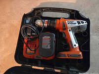 Open carry case showing drill, charger and battery packs